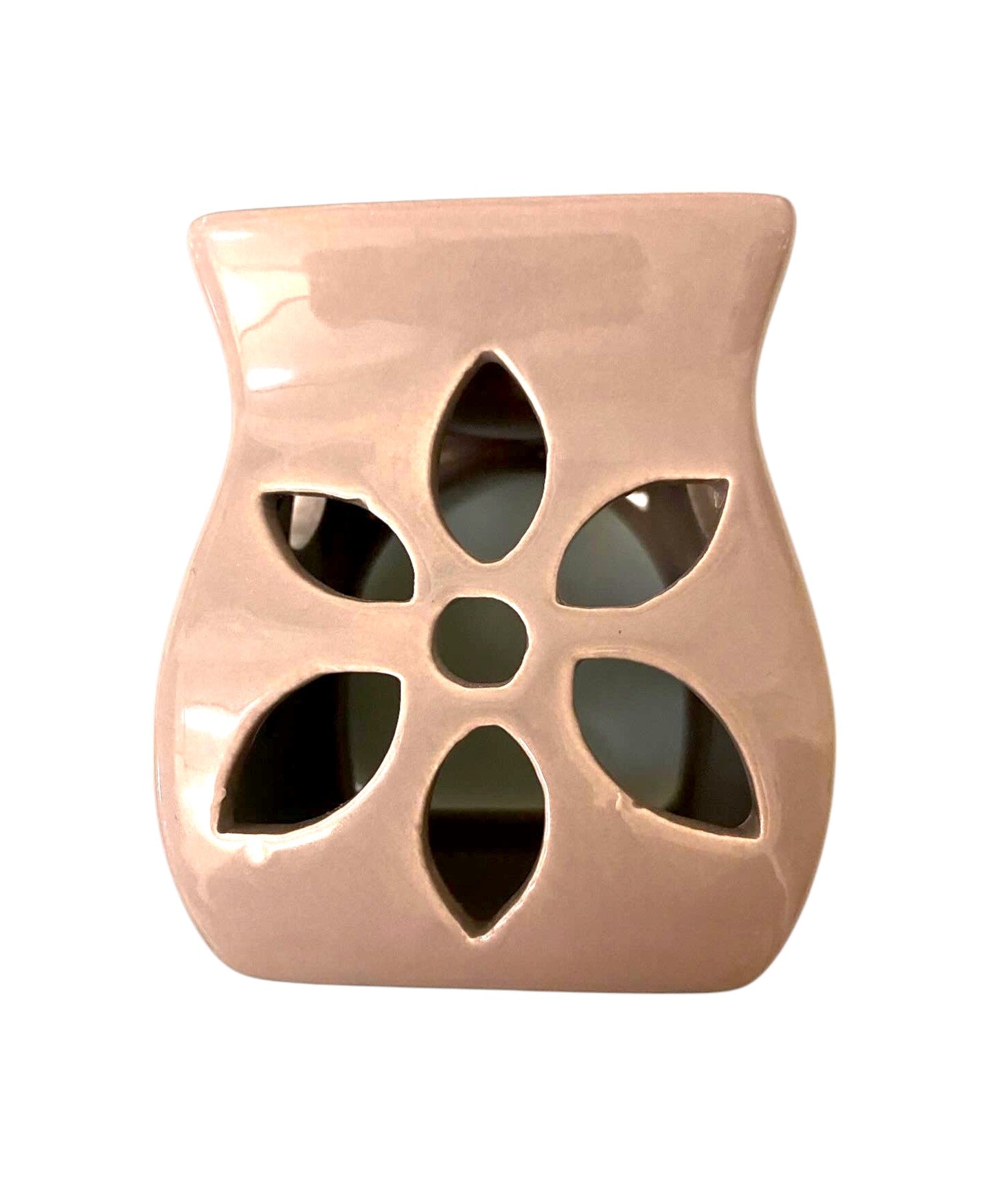A pink tea light candle warmer placed on a plain white background, creating a warmer complement ambiance.